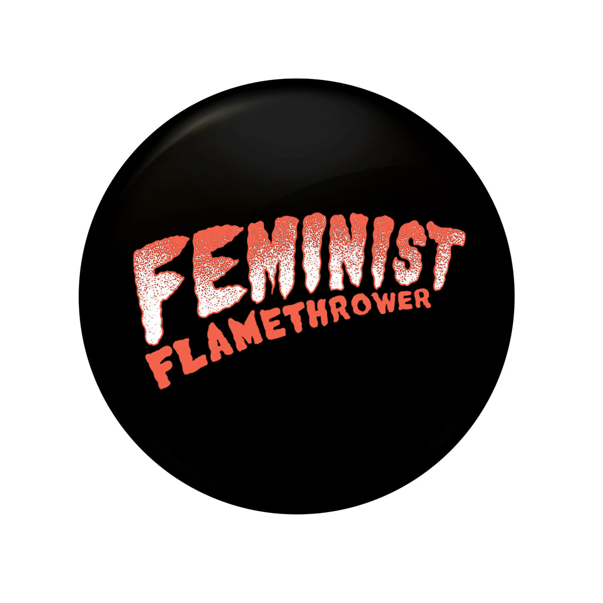 A black 1&quot; button by The Drowns features bold, textured pink &quot;FEMINIST&quot; lettering and smaller orange &quot;FLAMETHROWER&quot; below—a true Feminist Flamethrower statement piece.