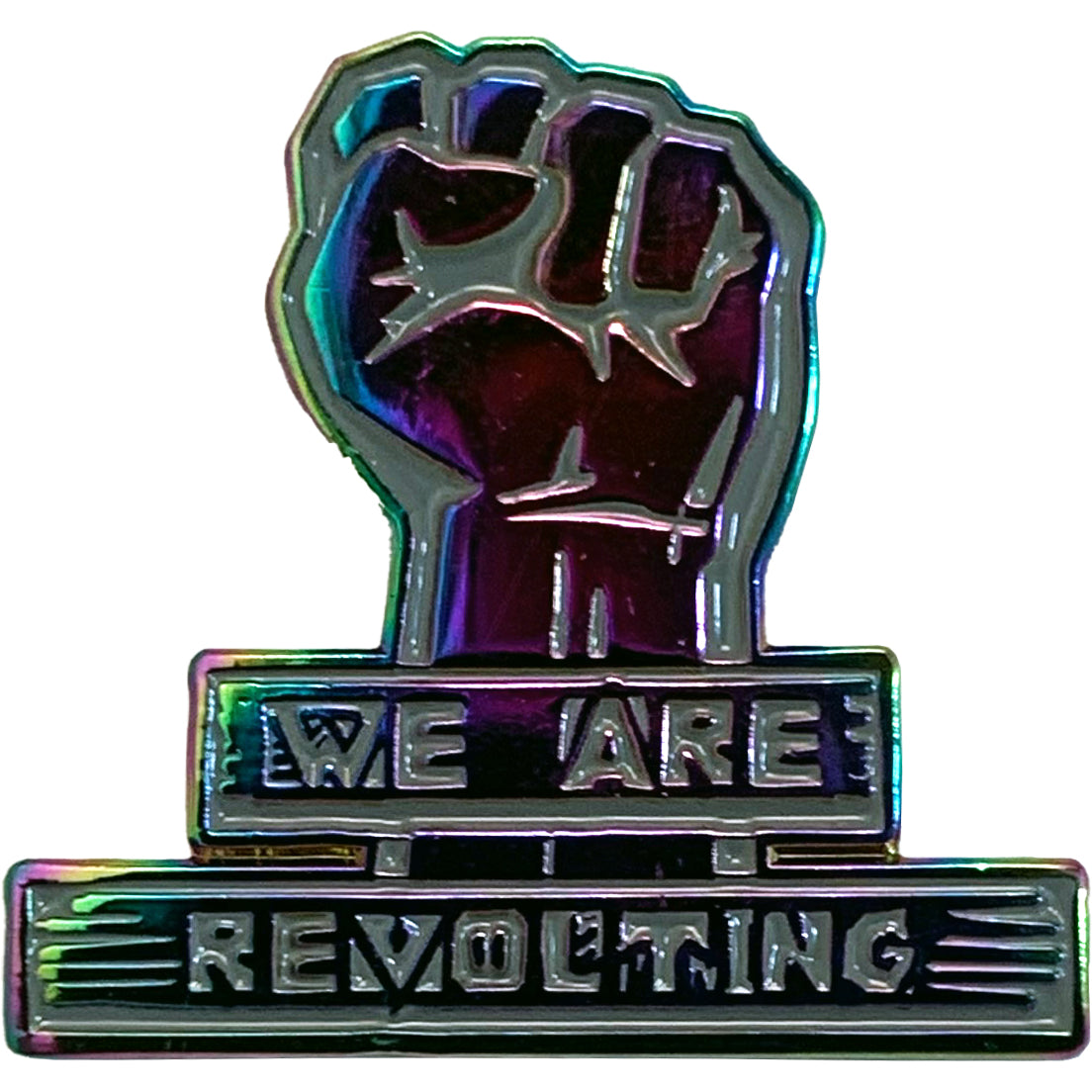 The Restarts metallic punk pin features a raised fist with &quot;WE ARE REVOLTING&quot; above and below it, plus a bold iridescent rainbow enamel finish for maximum impact.