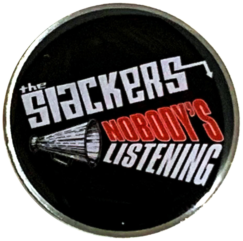 This enamel pin by The Slackers displays &quot;THE SLACKERS NOBODY&#39;S LISTENING&quot; in red and white text with a megaphone on a black background—an ideal accessory for fans of Nobody&#39;s Listening.