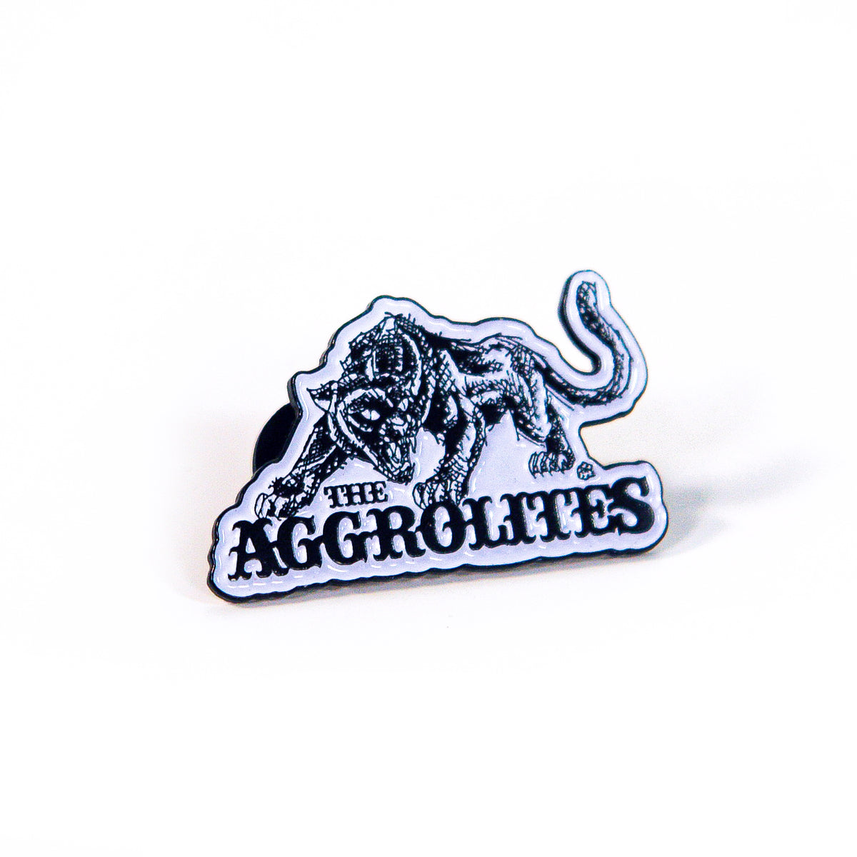 A black and white enamel pin by The Aggrolites featuring a snarling illustrated panther above bold text reading THE AGGROLITES on a white background.