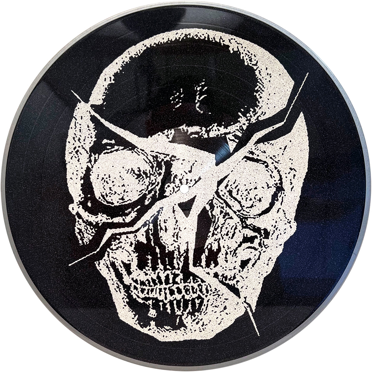The Mess vinyl record features a bold white cracked skull on black, its jagged lines capturing the raw energy and rebellious spirit of streetpunk and Oi!.