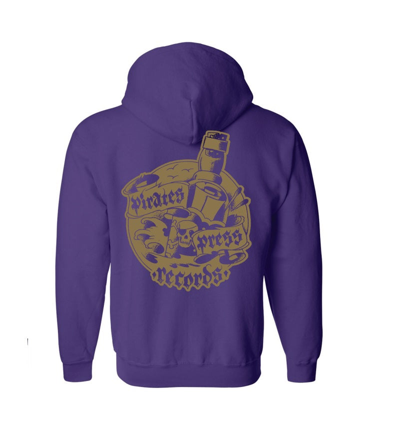 A purple zip-up hoodie by Pirates Press Records, featuring a gold back graphic with a skull, vinyl records, and a bottle.