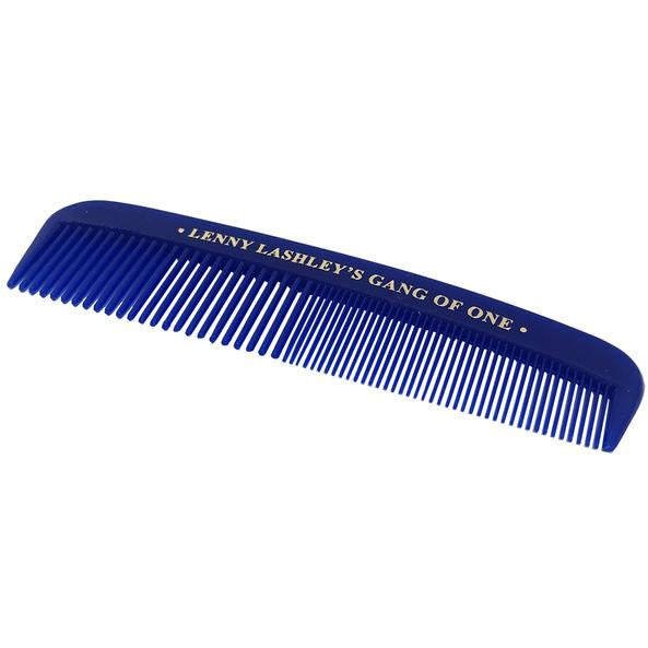 A blue plastic comb with fine and wide teeth, featuring &quot;Lenny Lashley&#39;s Gang Of One&quot; in white along the top edge. All Hair Welcome.