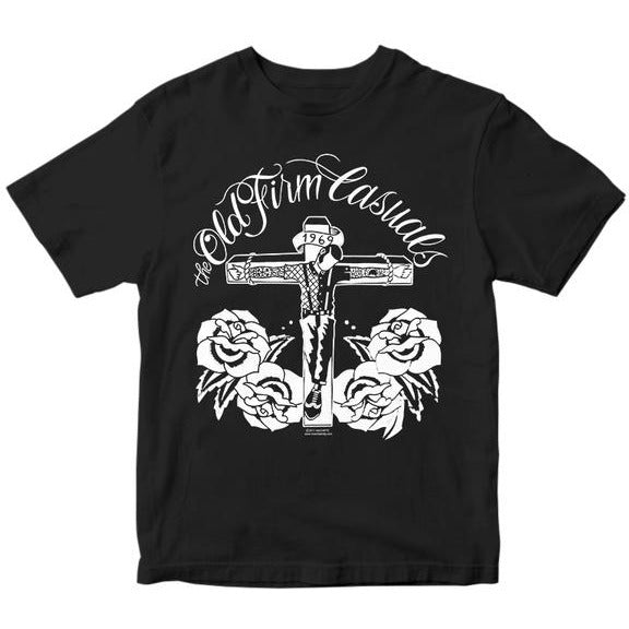 Black Gildan T-shirt by The Old Firm Casuals with a white cross, 1969, three roses, and band name in stylized script—perfect for fans of the Crucified Roses T-shirt design.