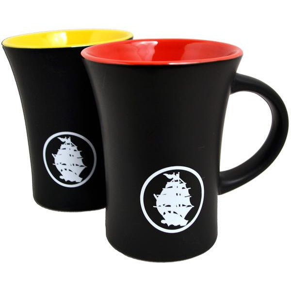 Set of two 10oz matte black Pirates Press Records bistro mugs with flared rims and a white sailing ship emblem. Each mug has a colored interior—one red, one yellow—for a bold addition to your drinkware collection.