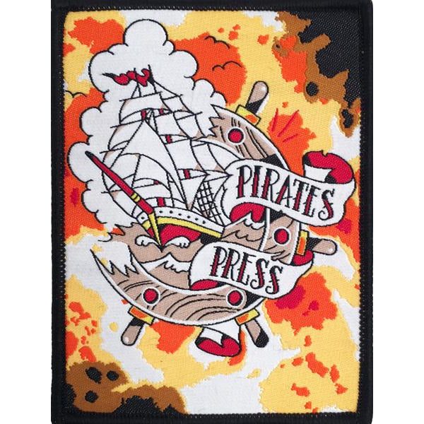 This 3x4 embroidered patch by Pirates Press Records features a sailing ship, clouds, and waves, with &quot;Pirates Press&quot; banners over an orange, yellow, and black camo background.