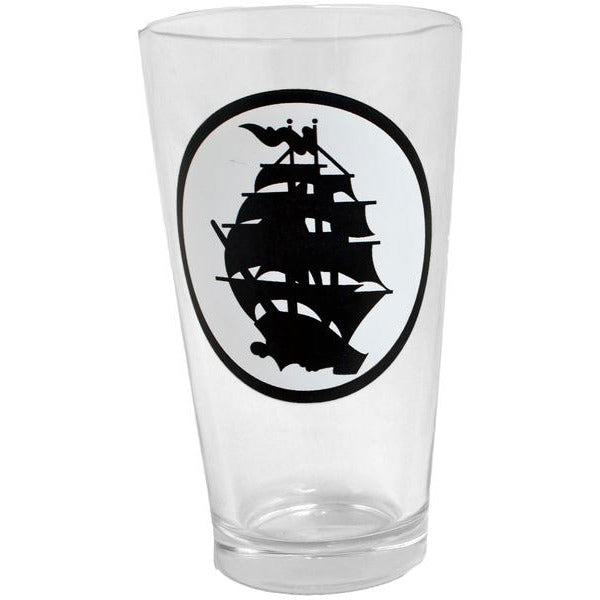 A 16oz pint glass from Pirates Press Records, made in the USA, featuring a black silhouette of a sailing ship inside an oval frame printed on the side.