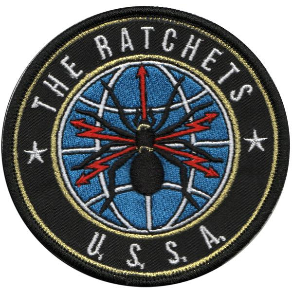 A black and blue embroidered patch by Ratchets featuring a spider in the center.