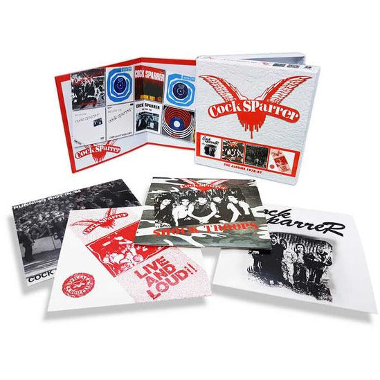 A Cock Sparrer box set from Cherry Red, showcasing several punk rock albums with unique cover art and band photos. The set includes an open booklet and comes in a stylish white and red package.