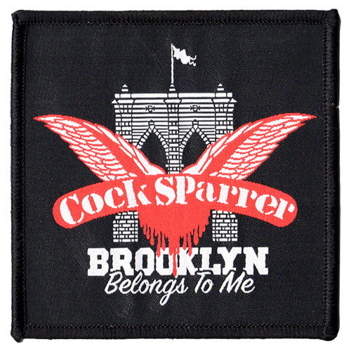 A Cock Sparrer woven patch displays a red winged logo above a stylized Brooklyn Bridge. Below, BROOKLYN Belongs To Me appears in white text on a black background.