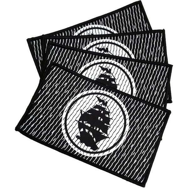 Four black rectangular woven patches from Pirates Press Records feature white diagonal lines and a central sailing ship in a white circle, stacked with slight overlap and finished with heat seal backing.
