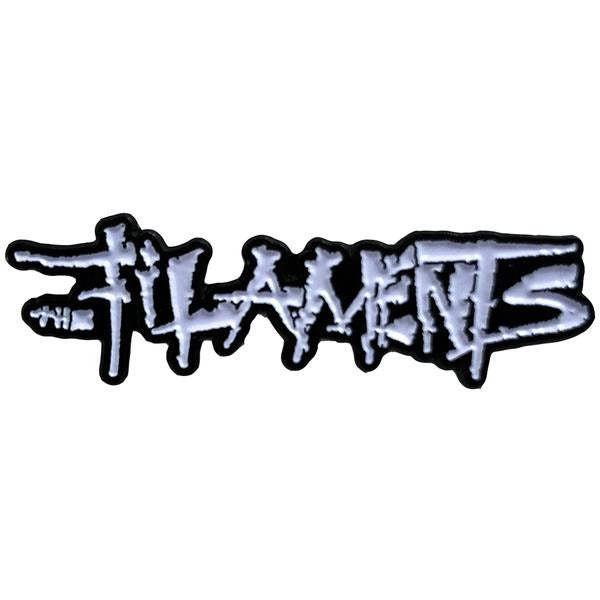The Filaments logo in rough, graffiti-style white text with jagged edges on a black background—ideal for a black and white enamel pin.