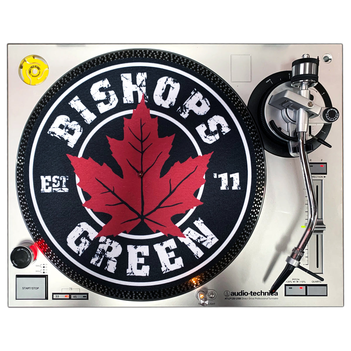 A Bishops Green silver Audio-Technica turntable with a DJ slipmat featuring a bold red Maple Leaf and Bishops Green Est. 11 in white letters.