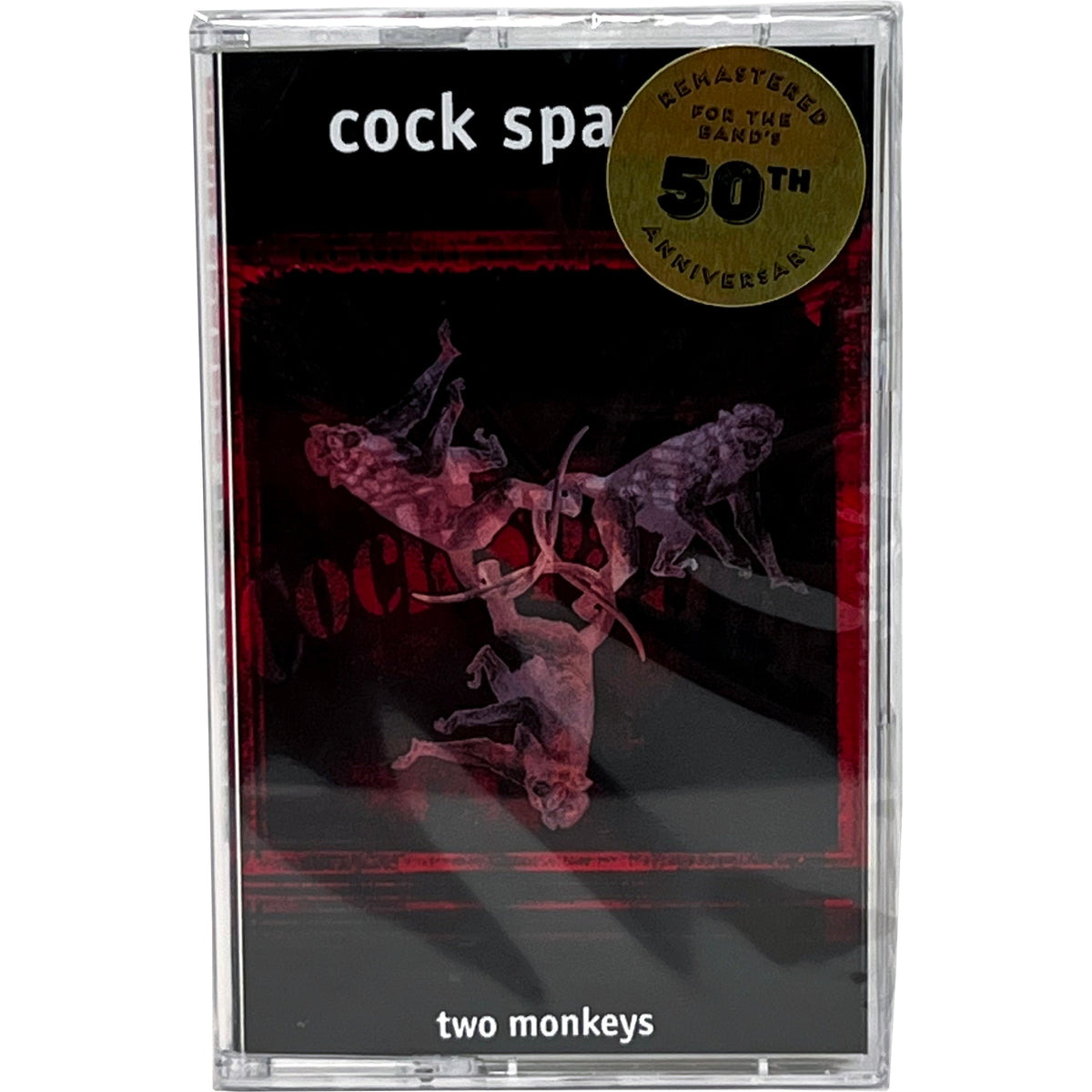 A punk rock cassette tape cover of Cock Sparrer’s album Two Monkeys, featuring two monkeys and a gold sticker stating Remastered for the bands 50th anniversary.