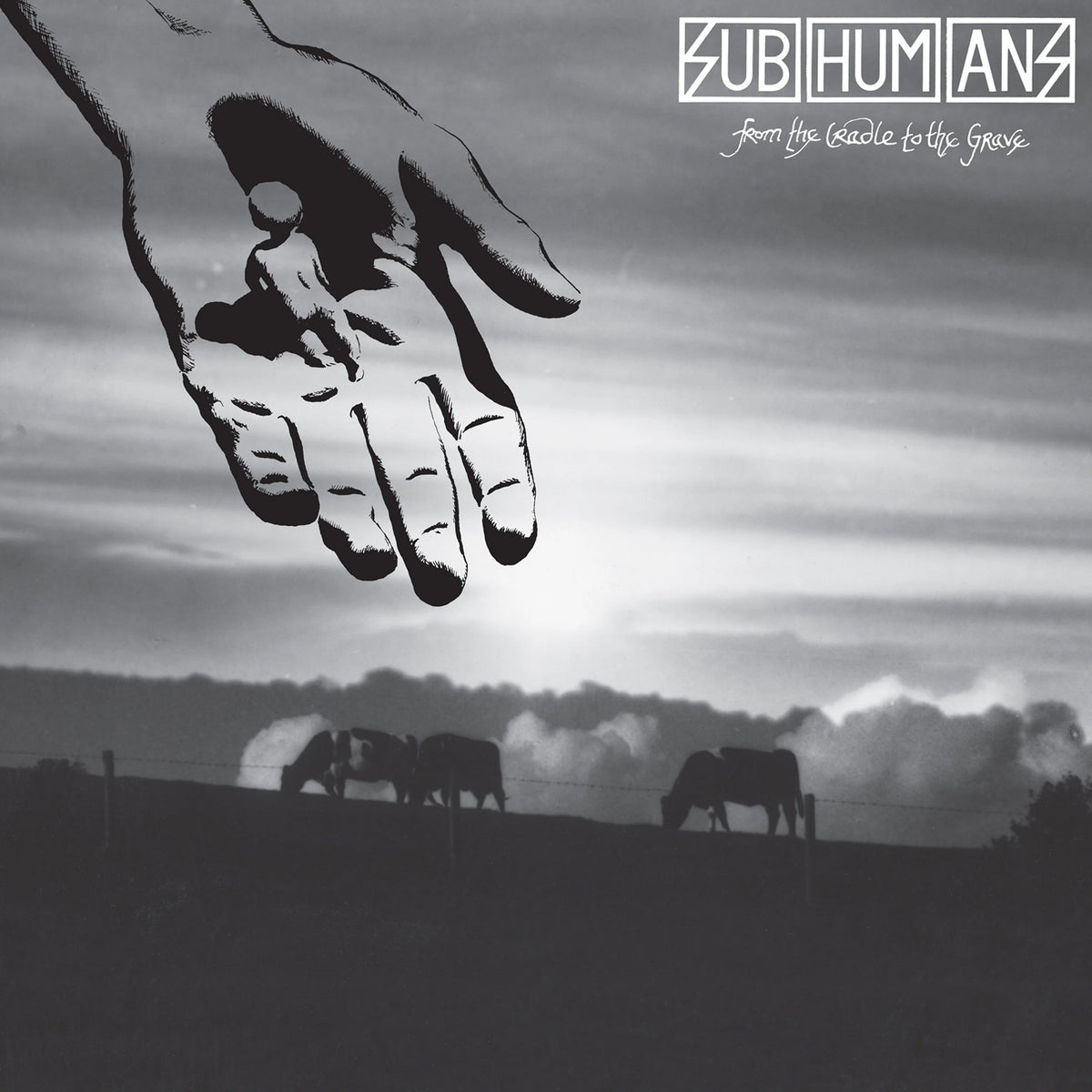 Black and white cover art shows cows grazing at dusk, with a large hand holding a small human above them. Subhumans and the anarcho punk classic From the Cradle to the Grave appear in the top right corner.