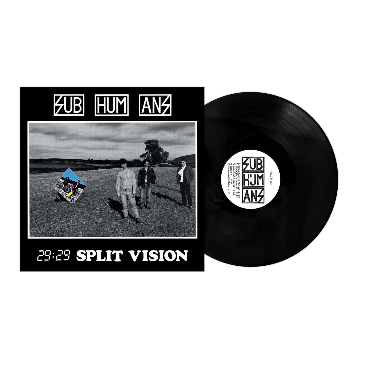 A vinyl record is partially pulled from its cover, which shows three people in a field. The brand name Subhumans is printed on both the cover and the record label.