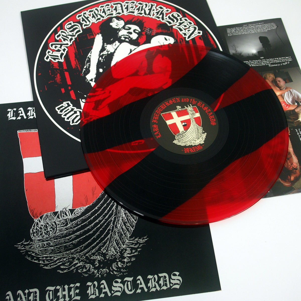A red and black marbled vinyl from Lars Frederiksen &amp; The Bastards’ Viking album on Hellcat Records, featuring a shield label, is shown atop its bold cover and comes with an info-packed insert.