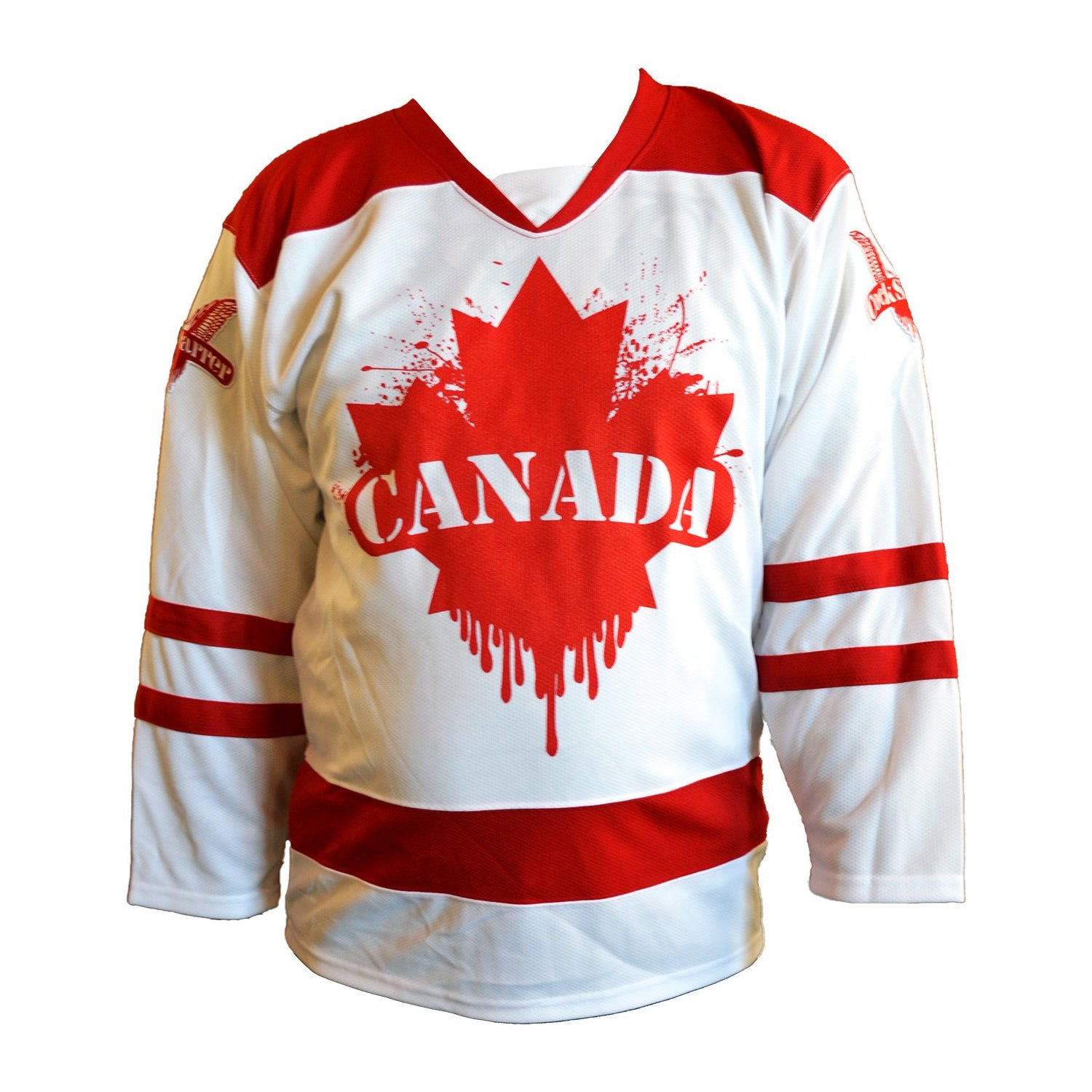 White and red screenprinted Cock Sparrer hockey jersey featuring a large red maple leaf and Canada on the front, with red sleeve and bottom stripes, red shoulder panels, and embroidered wing patches on both shoulders.