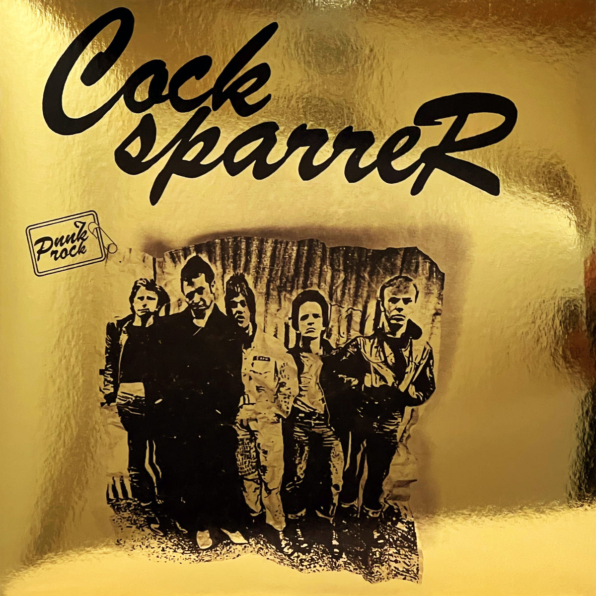 A gold background displays the black Cock Sparrer logo at the top for their 50th anniversary, Punk Rock in a small box on the left, and a black-and-white photo of five men standing side by side.